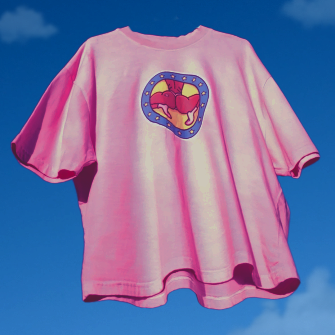Pink t-shirt with a colorful logo on a blue sky background