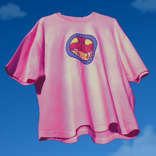 Pink t-shirt with a colorful logo on a blue sky background